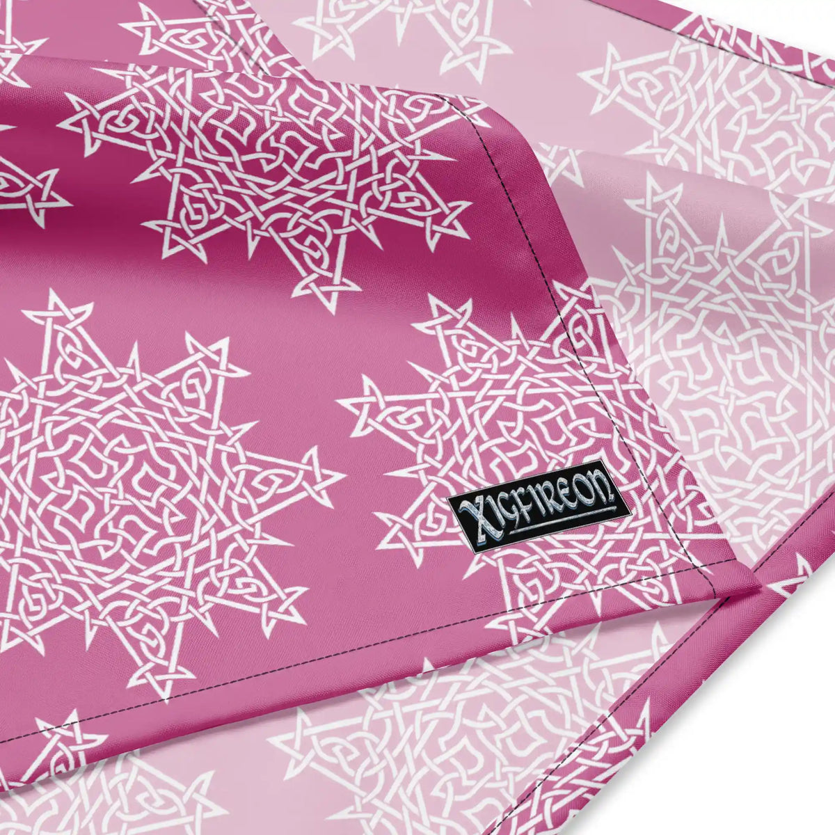 A close up view of the Xigfireon logo on a large sized (25.25 inch x 25.25 inch) Morning Star Fire Pink and White bandana.