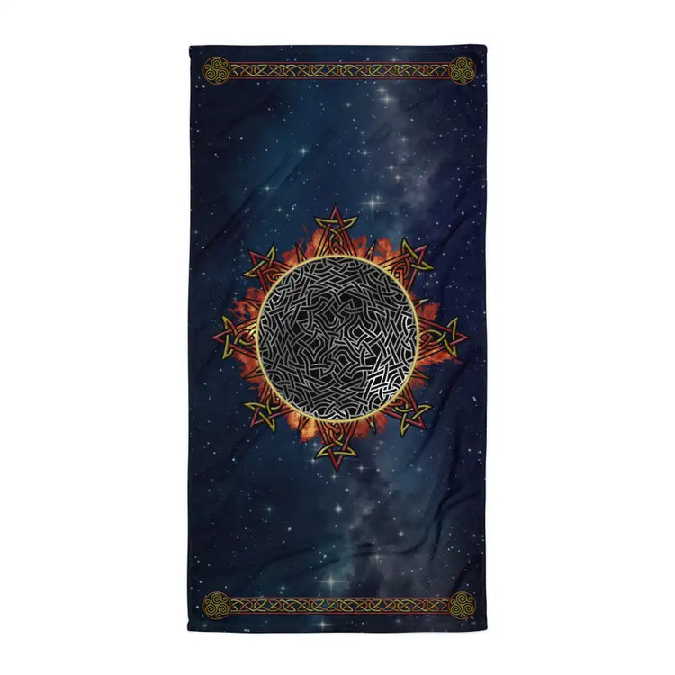 A Xigfireon beach towel (or bath towel) featuring the Eclipsed iteration of the `Morning Star Fire` Celtic knot with braided borders ending in triskelions at the narrow ends.