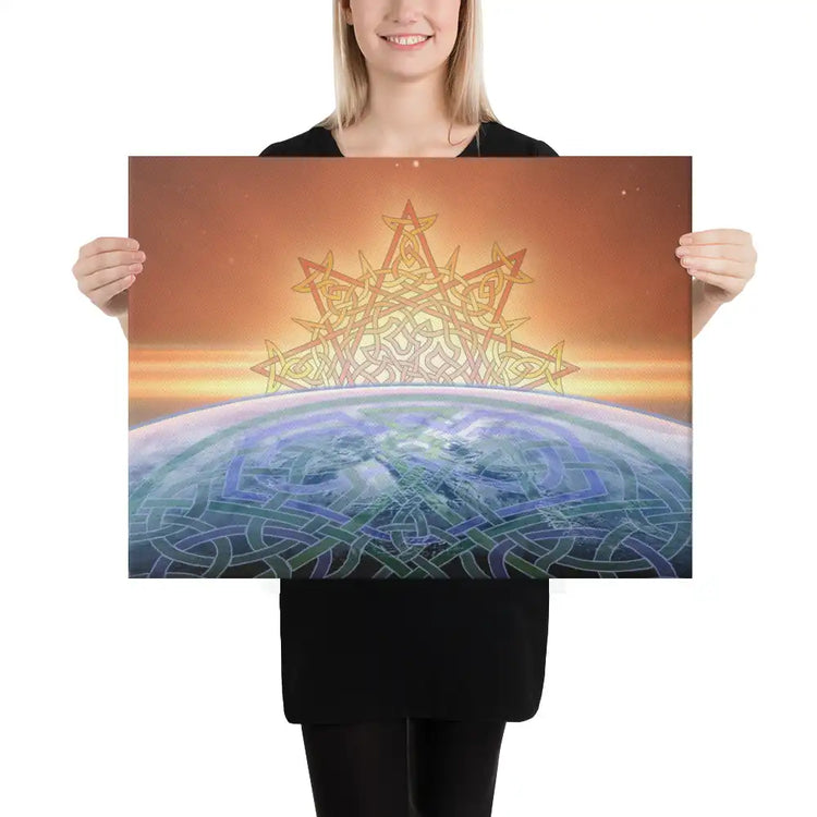 A young woman holding an 18 inch x 24 inch canvas print of the Derivation II Celtic knot design, which symbolizes the Sun and the Earth and their cosmic dance.