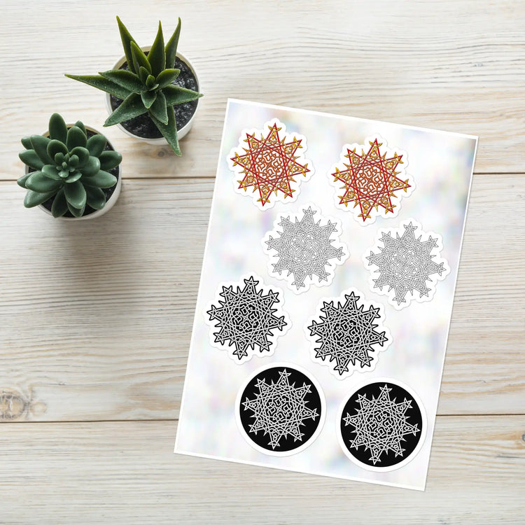A Xigfireon Celtic knot sticker sheet consisting of 8 individual Morning Star Fire stickers, 2 each of the Fire Colour, Black & White Hollow, Black & White Solid, and Black & White Circle iterations. The Morning Star Fire Celtic knot represents the Sun.