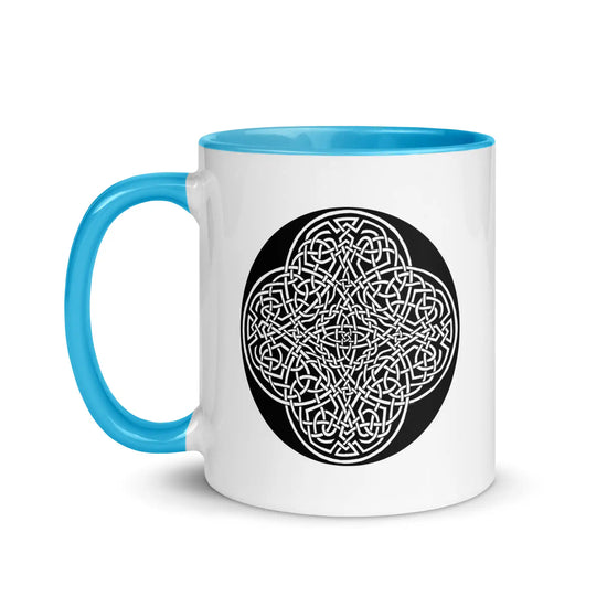 A Xigfireon white ceramic 11oz mug featuring the Black & White Circle iteration of the Reach Of The Spirit Celtic knot design, with blue handle and inside. This Celtic knot symbolizes Mother Earth.