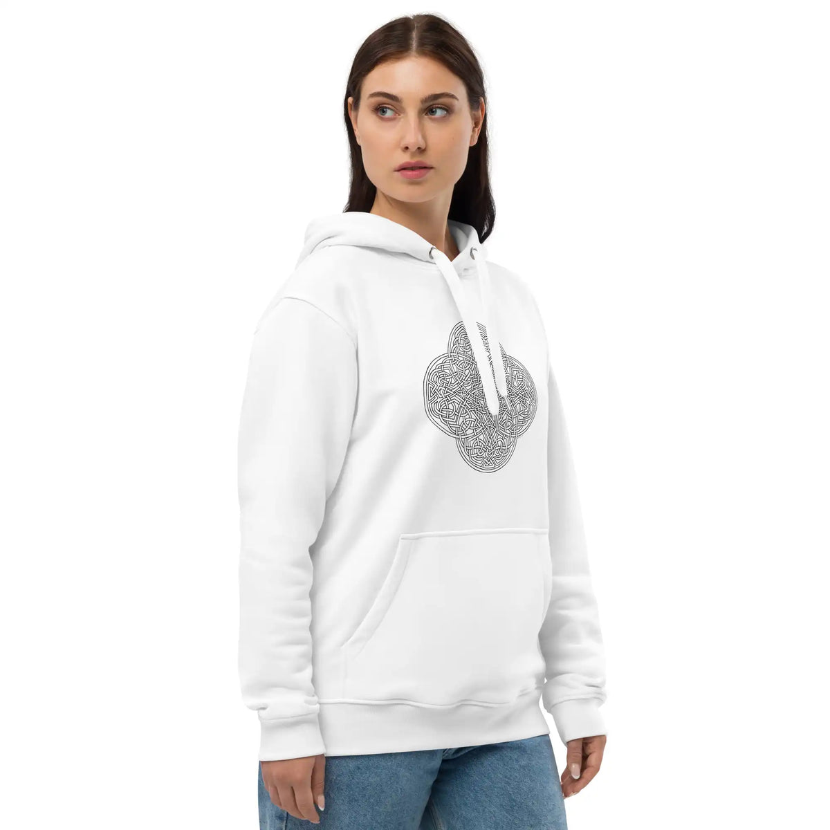 A young woman wearing a white Xigfireon graphic eco hoodie featuring the Black & White Hollow iteration of the Reach Of The Spirit Celtic knot design. The Reach Of The Spirit Celtic knot is an Earth symbol.
