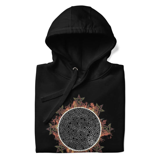 A folded black Xigfireon graphic hoodie featuring the Eclipsed iteration of the Morning Star Fire Celtic knot design, inspired by the 2023 Annular Solar Eclipse.