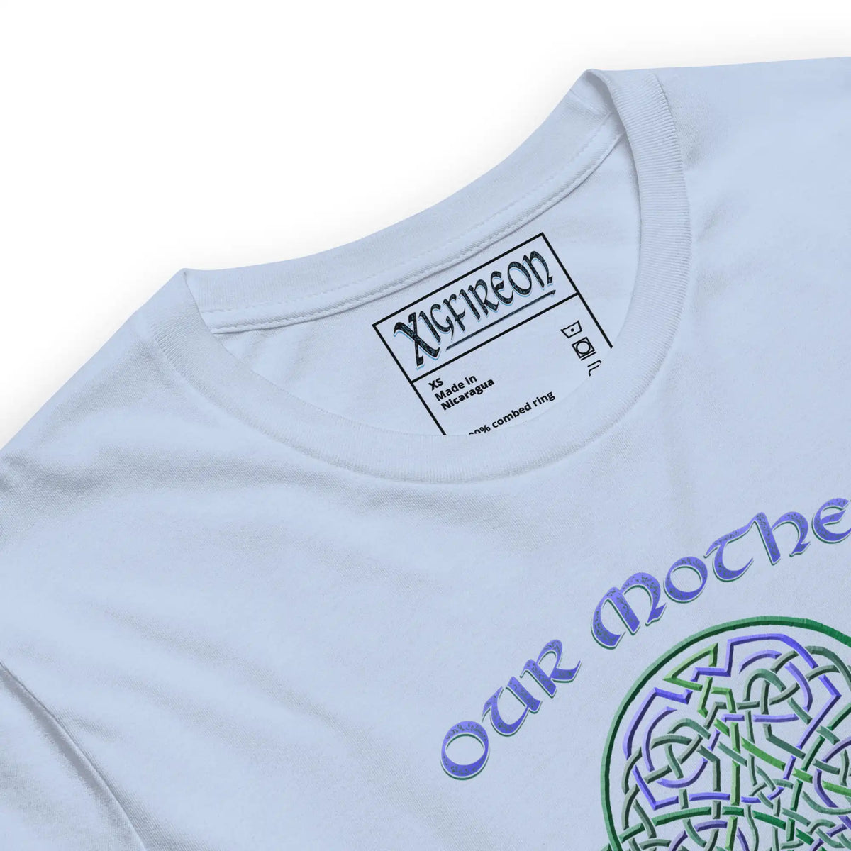 A close up of a baby blue Xigfireon graphic t-shirt featuring the Living Colour iteration of the Reach Of The Spirit Celtic knot design along with a message in a Celtic font: "Our Mother, Cherish Her".
