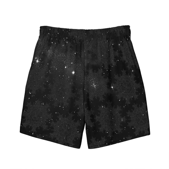 Celtic knot swim trunks by Xigfireon, shown from the back, featuring the Midnight Cosmos patterned series of the `Morning Star Fire` design.