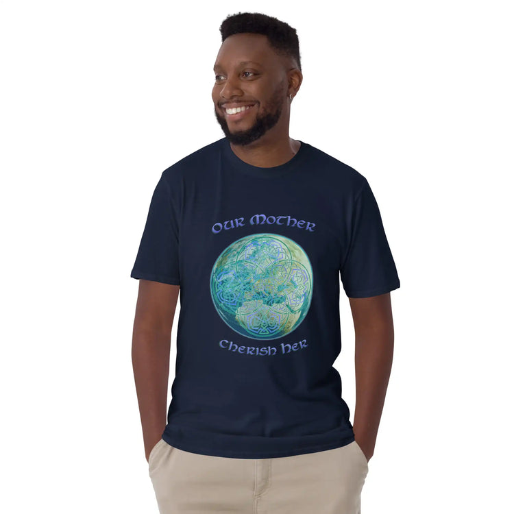 A young man wearing a navy blue Xigfireon graphic t-shirt featuring the Sacred Planet iteration of the `Reach Of The Spirit` Celtic knot design along with a message in a Celtic font: "Our Mother, Cherish Her".