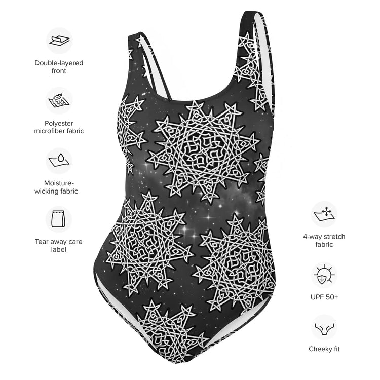 A list of product features surrounding a Xigfireon graphic swimsuit featuring the Black & White Solid Cosmos patterned series of the `Morning Star Fire` Celtic knot design. Features include double-layered front, polyester microfiber fabric, moisture-wicking fabric, tear away care label, 4-way stretch, UPF 50+, and cheeky fit.