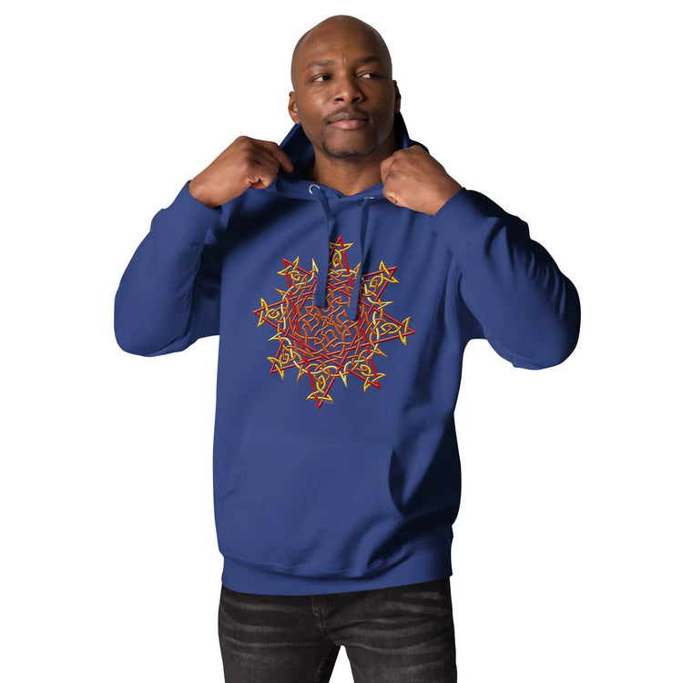 A young man wearing a team royal blue Xigfireon graphic hoodie featuring the Fire Colour iteration of the `Morning Star Fire` Celtic knot design. The `Morning Star Fire` Celtic knot represents our glorious Sun.