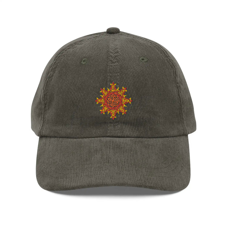 The front side of an olive green Xigfireon vintage corduroy cap embroidered with the Fire Colour iteration of the `Morning Star Fire` Celtic knot design.