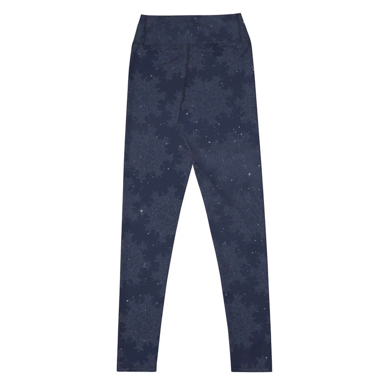 The back side of a pair of Xigfireon graphic yoga leggings featuring the Midnight Blue Cosmos patterned series of the `Morning Star Fire` Celtic knot design.