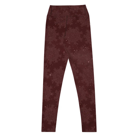 The back side of a pair of Xigfireon graphic yoga leggings featuring the Midnight Red Cosmos patterned series of the `Morning Star Fire` Celtic knot design.