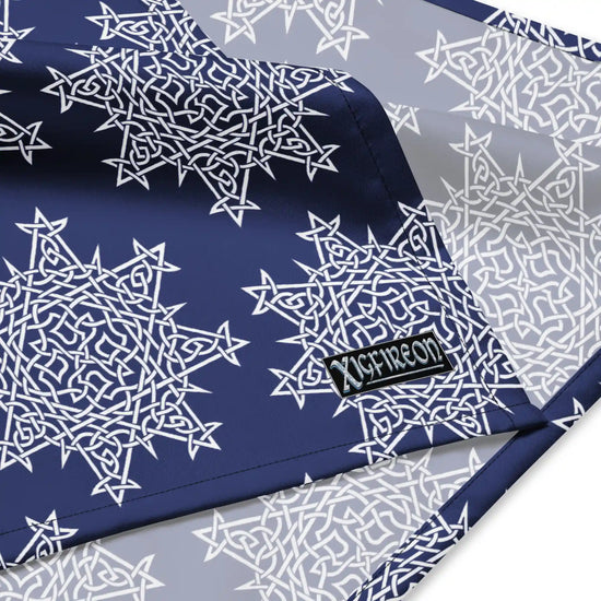 A close up view of the Xigfireon logo on a large sized (25.25 inch x 25.25 inch) `Morning Star Fire` Navy Blue and White bandana.