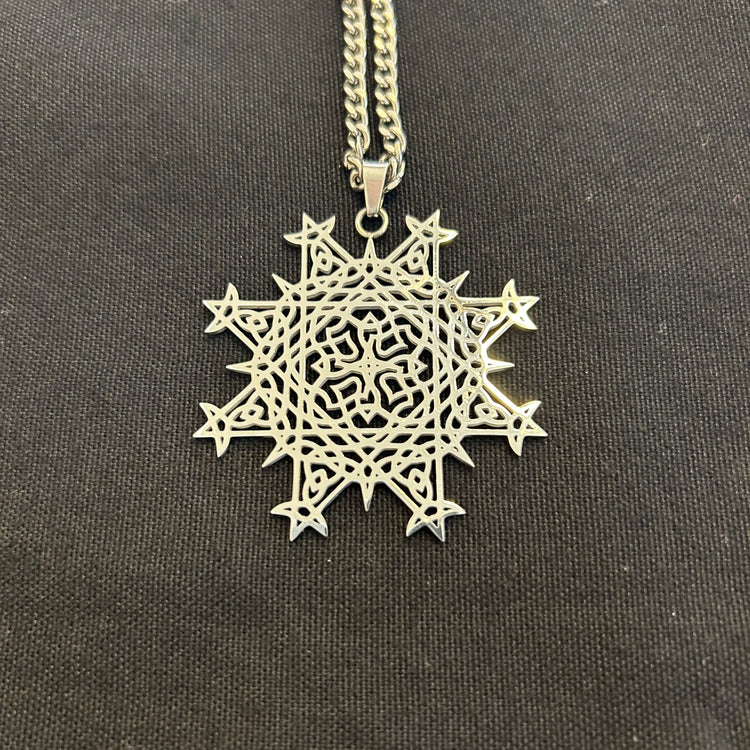 A view of a `Morning Star Fire` Flat stainless steel pendant neckless by Xigfireon.