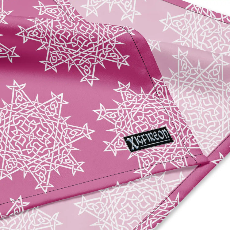 A close up view of the Xigfireon logo on a large sized (25.25 inch x 25.25 inch) `Morning Star Fire` Pink and White bandana.