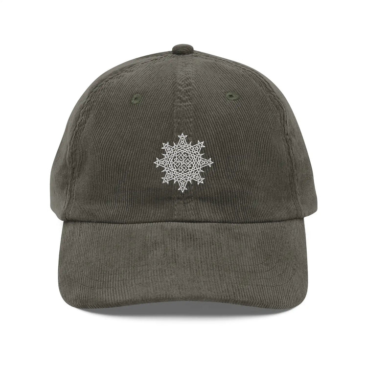 The front side of an olive green Xigfireon vintage corduroy cap embroidered with the White iteration of the `Morning Star Fire` Celtic knot design.