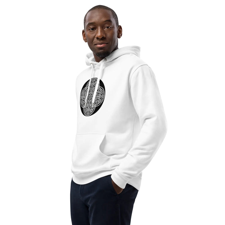 A young man wearing a white Xigfireon graphic eco hoodie featuring the Black & White Circle iteration of the `Reach Of The Spirit` Celtic knot design. The `Reach Of The Spirit` Celtic knot represents our glorious Mother Earth.