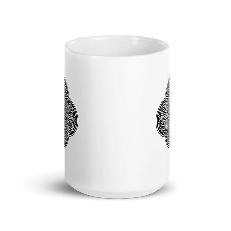 The front side of a Xigfireon white glossy 15oz mug featuring the Black & White Solid iteration of the `Reach Of The Spirit` Celtic knot design. This Celtic knot symbolizes Mother Earth.