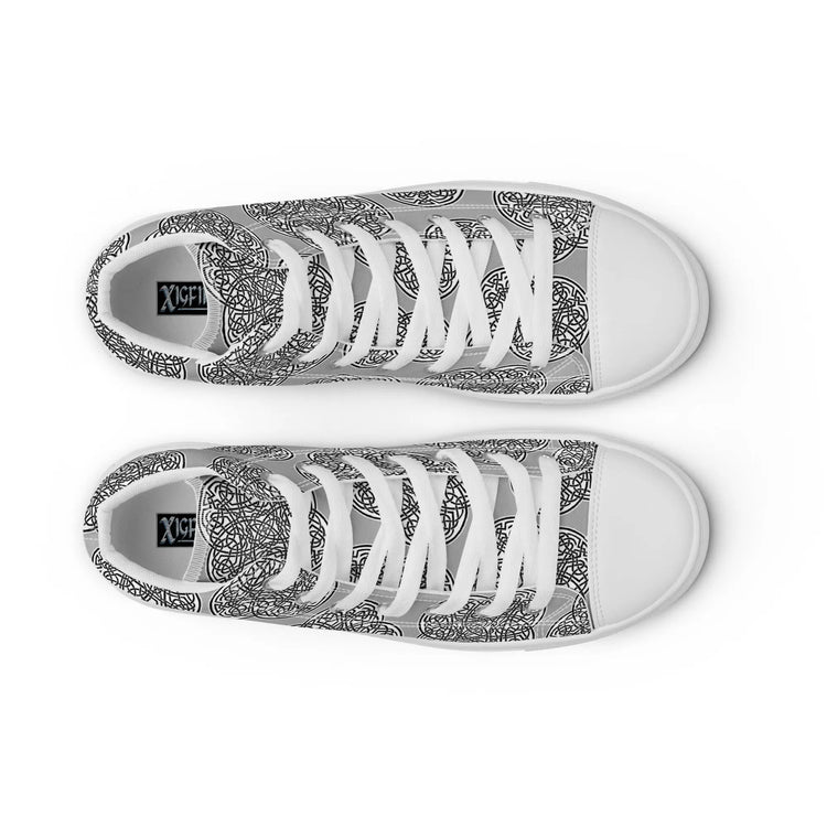 A view from above of a pair of Xigfireon canvas high tops featuring the Inverted Black & White Solid iteration of the `Reach of The Spirit` Celtic knot pattern. The Xigfireon logo is visible inside each shoe.