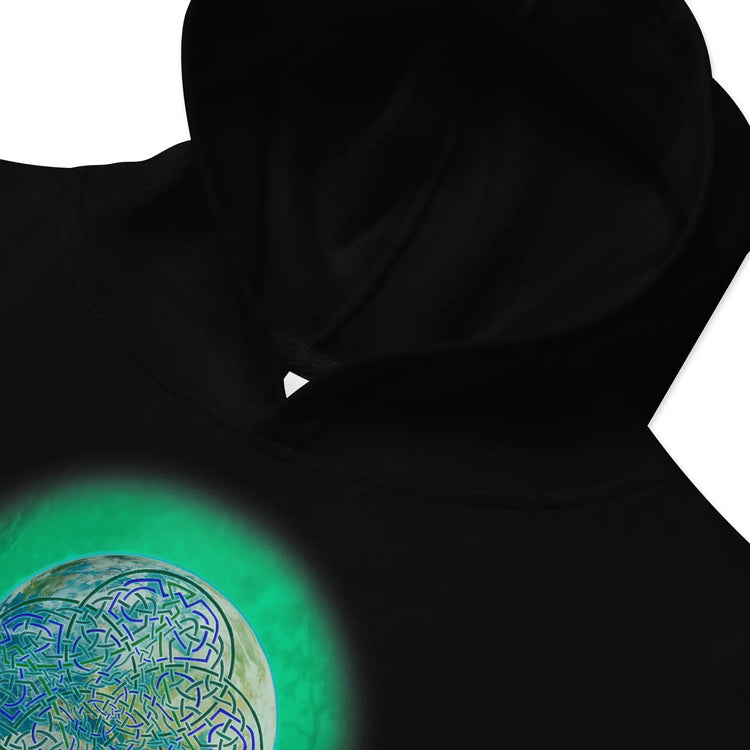 A zoomed-in view of a kids black graphic hoodie featuring the Deep Forest iteration of the `Reach Of The Spirit` Celtic knot design.