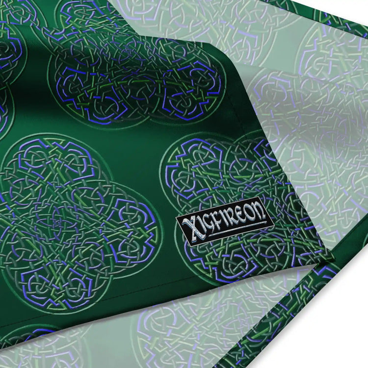 A close up view of the Xigfireon logo on a medium sized (21.25 inch x 21.25 inch) `Reach Of The Spirit` Living Colour forest bandana.