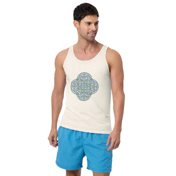A young man wearing blue shorts and an oatmeal triblend graphic tank top featuring the Living Colour iteration of the `Reach Of The Spirit` Celtic knot design.