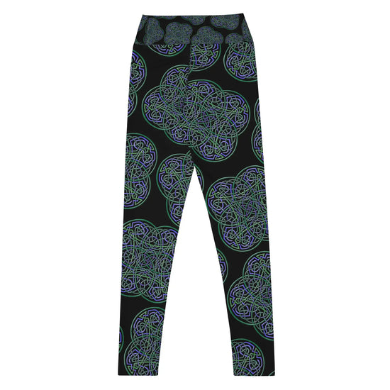 The back side of a pair of Xigfireon graphic yoga leggings featuring the Living Colour Black patterned series of the Reach Of The Spirit Celtic knot design.