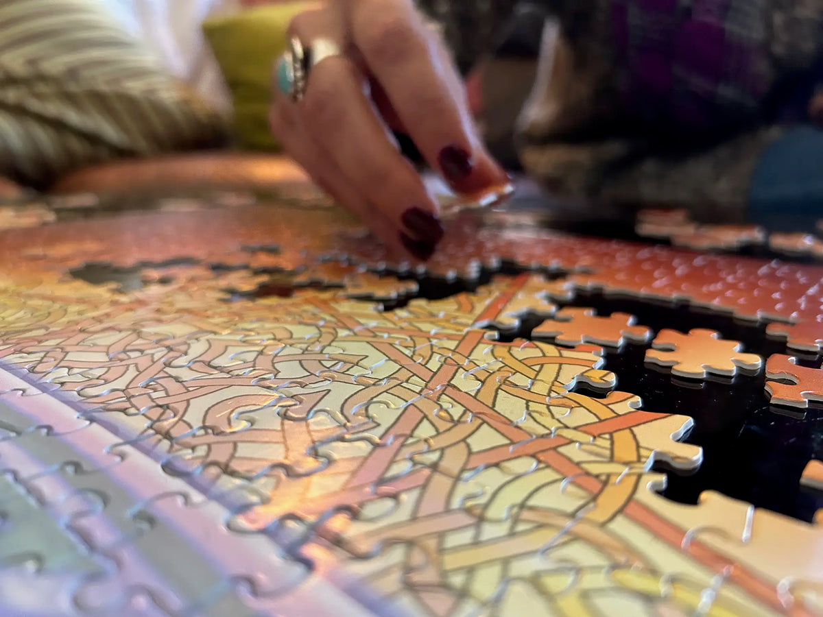 A 520 piece Xigfireon jigsaw puzzle featuring the `Derivation II` Celtic knot merger design, which symbolizes the Sun and the Earth and their cosmic dance.
