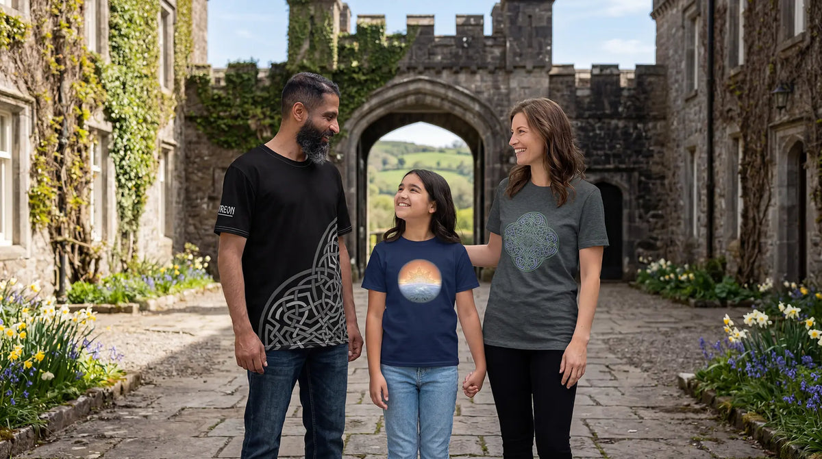 A young man, girl, and woman standing in an Irish castle courtyard, wearing Xigfireon Celtic knot graphic t-shirts featuring the `Morning Star Fire`, `Derivation II`, and `Reach Of The Spirit` Celtic knot designs.