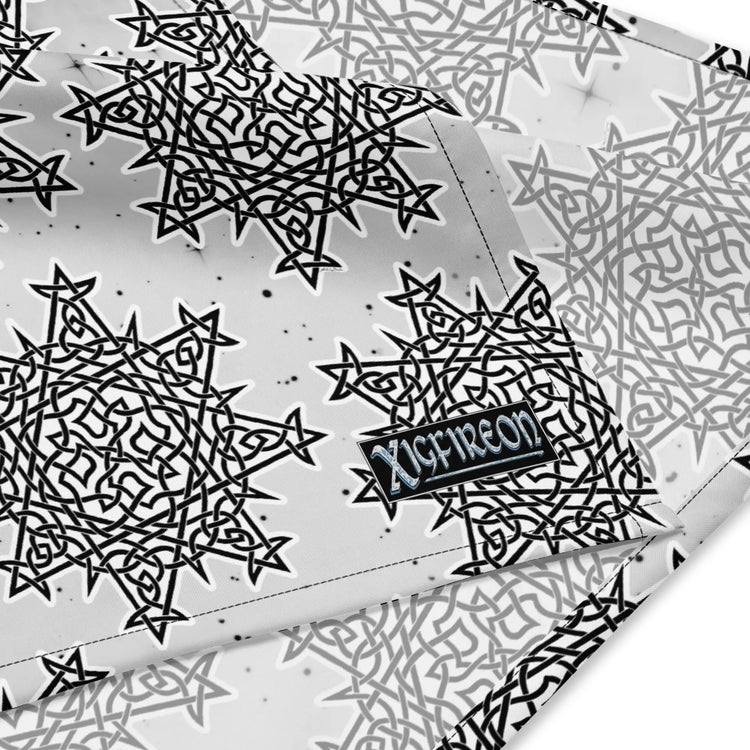 A close up view of the Xigfireon logo on a medium sized (21.25 inch x 21.25 inch) Morning Star Fire Black and White Solid Cosmos Inverted bandana.