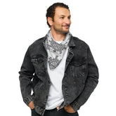 A young man wearing a Xigfireon bandana adorned with the Morning Star Fire Black and White Solid Cosmos Inverted Celtic knot pattern.