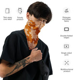 Person wearing a Xigfireon bandana featuring Orange and White patterned series of the `Morning Star Fire` Celtic knot design with product features listed on the side.