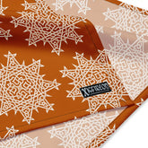 A close up view of the Xigfireon logo on a large sized (25.25 inch x 25.25 inch) `Morning Star Fire` Orange and White bandana.