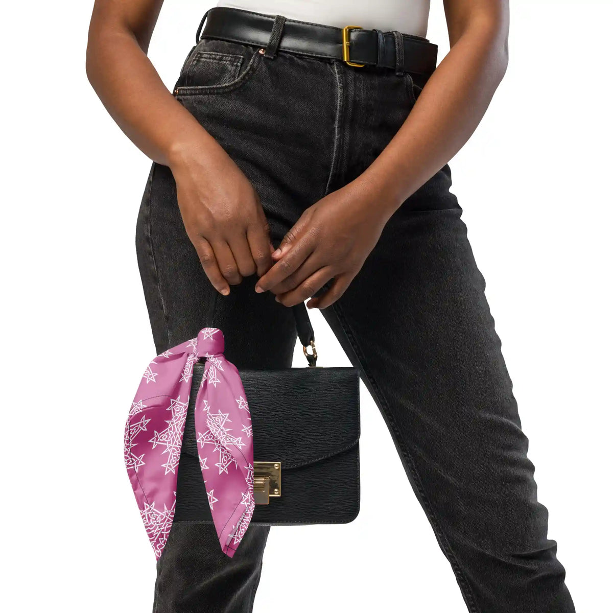 A young woman shown carrying a small purse with a Xigfireon Morning Star Fire Pink and White bandana tied to one of its straps.
