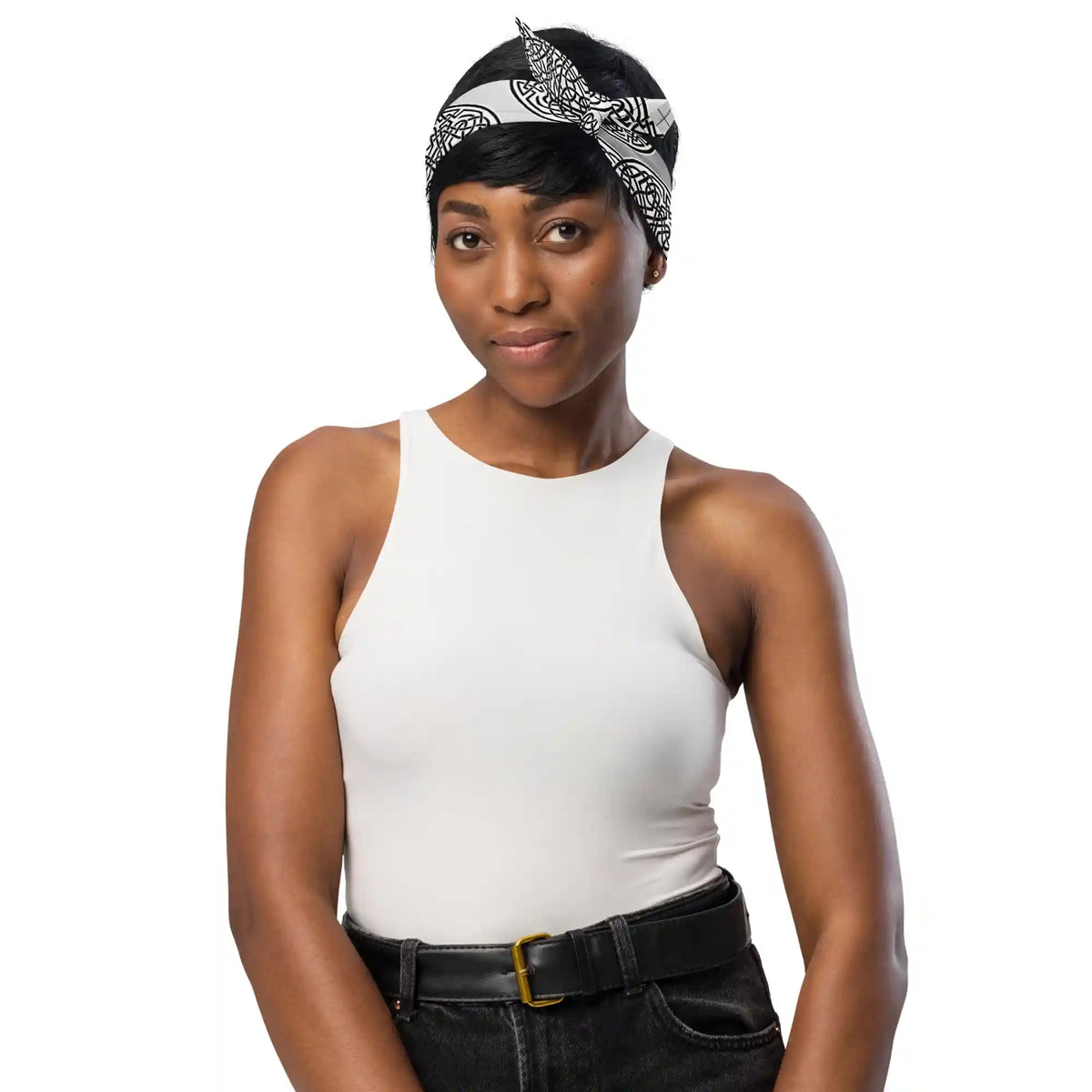 A young woman shown wearing a Xigfireon bandana adorned with the Reach Of The Spirit Black and White Solid Forest Inverted Celtic knot pattern.