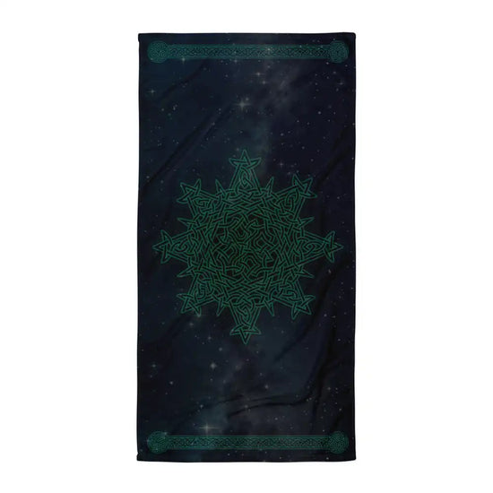 A Xigfireon beach towel (or bath towel) featuring the Celestial iteration of the `Morning Star Fire` Celtic knot with braided borders ending in triskelions at the narrow ends.