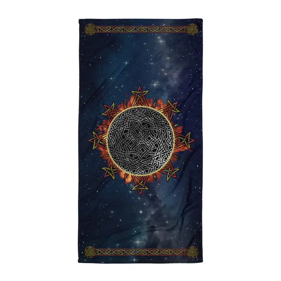 A Xigfireon beach towel (or bath towel) featuring the Eclipsed iteration of the `Morning Star Fire` Celtic knot with braided borders ending in triskelions at the narrow ends.