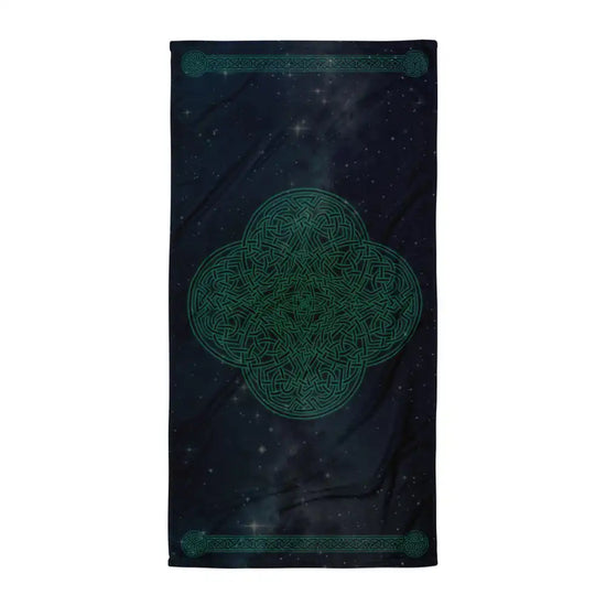 A Xigfireon bath and beach towel featuring the Celestial iteration of the Reach Of The Spirit Celtic knot design displayed against a brilliant star-filled night sky.