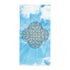A Xigfireon bath and beach towel featuring the Living Colour on Sky iteration of the Reach Of The Spirit Celtic knot design displayed against a vibrant blue sky with drifting white clouds.