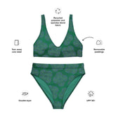 A list of product features surrounding a Xigfireon graphic bikini featuring the Living Colour Forest patterned series of the Reach Of The Spirit Celtic knot design. Features include recycled polyester and spandex blend fabric, tear away care label, removable paddings, double-layer, and UPF 50+.