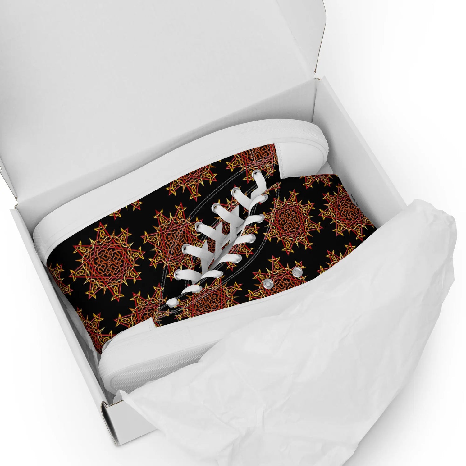 A shoebox containing a pair of black Xigfireon canvas high tops featuring the Fire Colour iteration of the Morning Star Fire Celtic knot pattern.