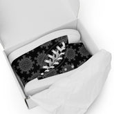 A shoebox containing a pair of black Xigfireon canvas high tops featuring the Greyscale iteration of the Morning Star Fire Celtic knot pattern.