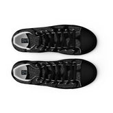 A view from above of a pair of Xigfireon black soled canvas high tops featuring the Greyscale iteration of the Reach Of The Spirit Celtic knot pattern. The Xigfireon logo is visible inside each shoe.