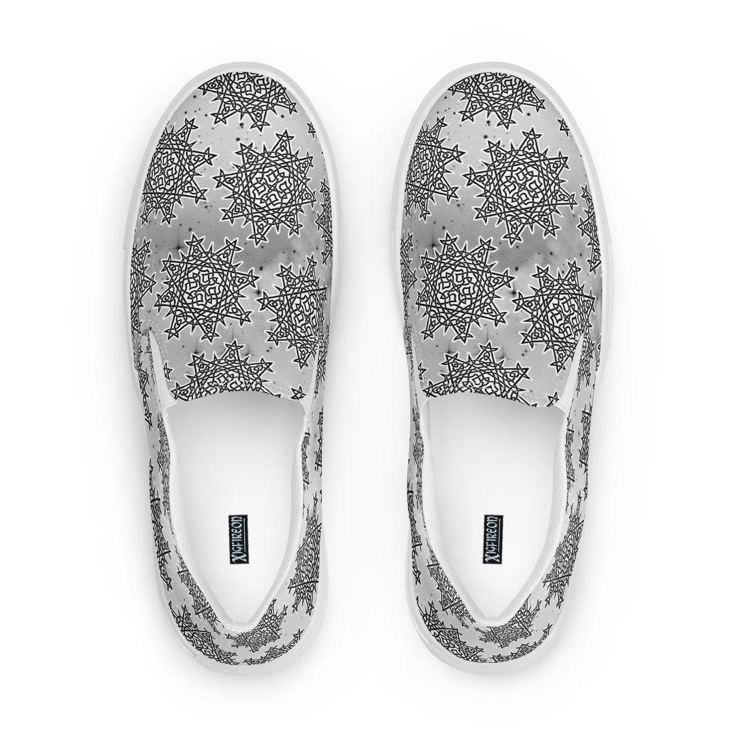 A view from above of a pair of Xigfireon canvas slip-ons featuring the Inverted Black & White Solid Cosmos iteration of the Morning Star Fire Celtic knot pattern. The Xigfireon logo is visible inside each shoe.