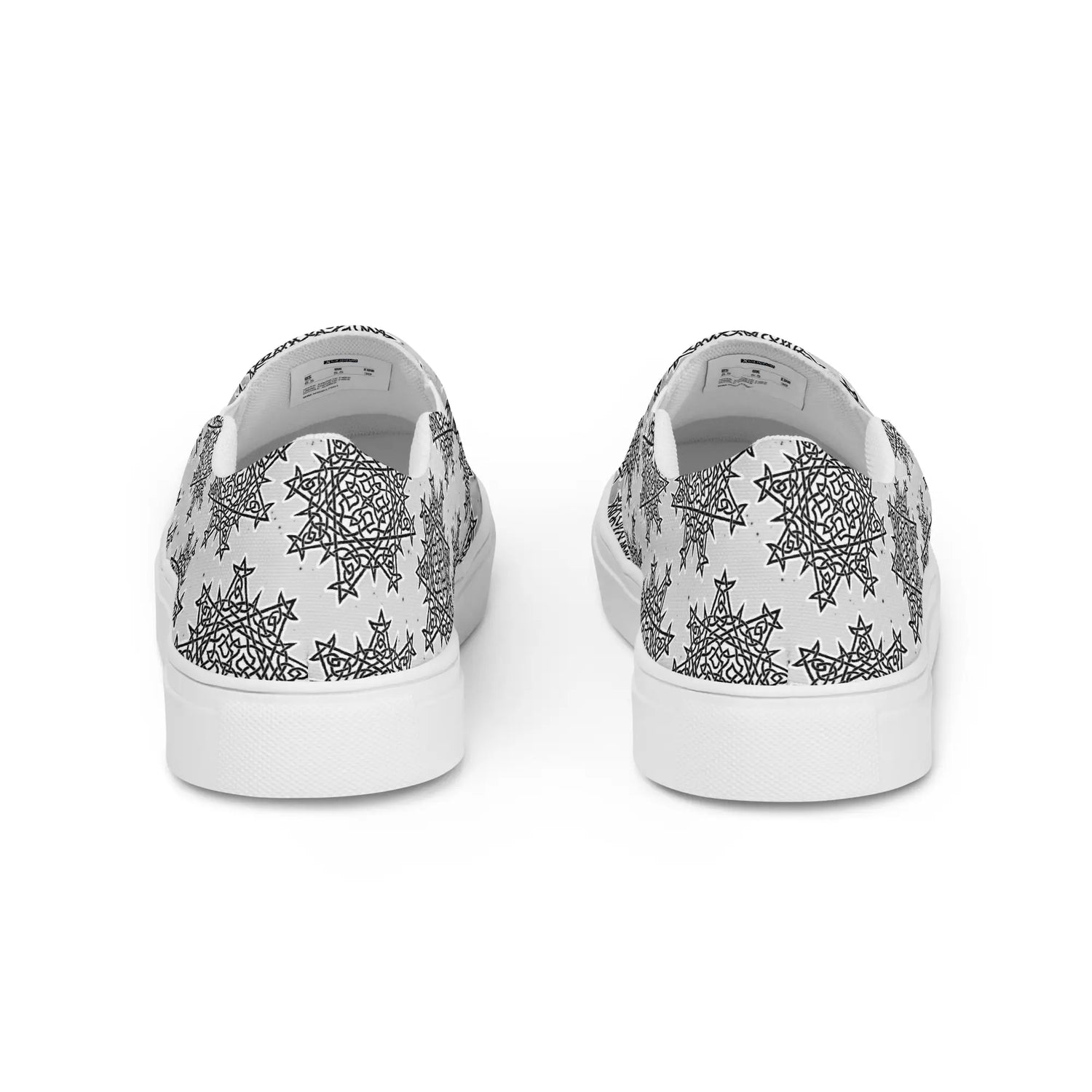 A view of the back of a pair of Xigfireon canvas slip-ons featuring the Inverted Black & White Solid Cosmos iteration of the Morning Star Fire Celtic knot pattern.