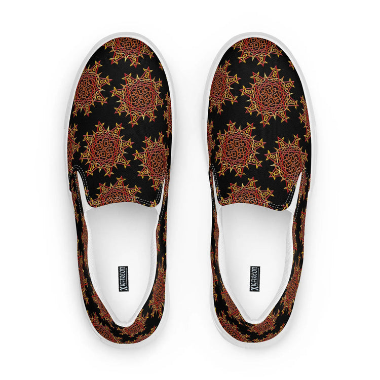 A view from above of a pair of Xigfireon canvas slip-on shoes featuring the Fire Colour on Black iteration of the Morning Star Fire Celtic knot pattern. The Xigfireon logo is visible inside each shoe.