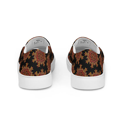 A view of the back of a pair of Xigfireon canvas slip-on shoes featuring the Fire Colour on Black iteration of the Morning Star Fire Celtic knot pattern. The Morning Star Fire Celtic knot represents the Sun.