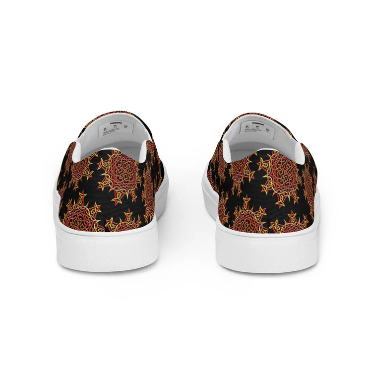 A view of the back of a pair of Xigfireon canvas slip-on shoes featuring the Fire Colour on Black iteration of the Morning Star Fire Celtic knot pattern. The Morning Star Fire Celtic knot represents the Sun.