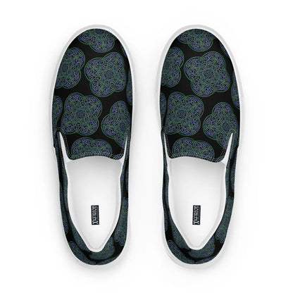 A view from above of a pair of Xigfireon canvas slip-on shoes featuring the Living Colour on Black iteration of the Reach Of The Spirit Celtic knot pattern. The Xigfireon logo is visible inside each shoe.