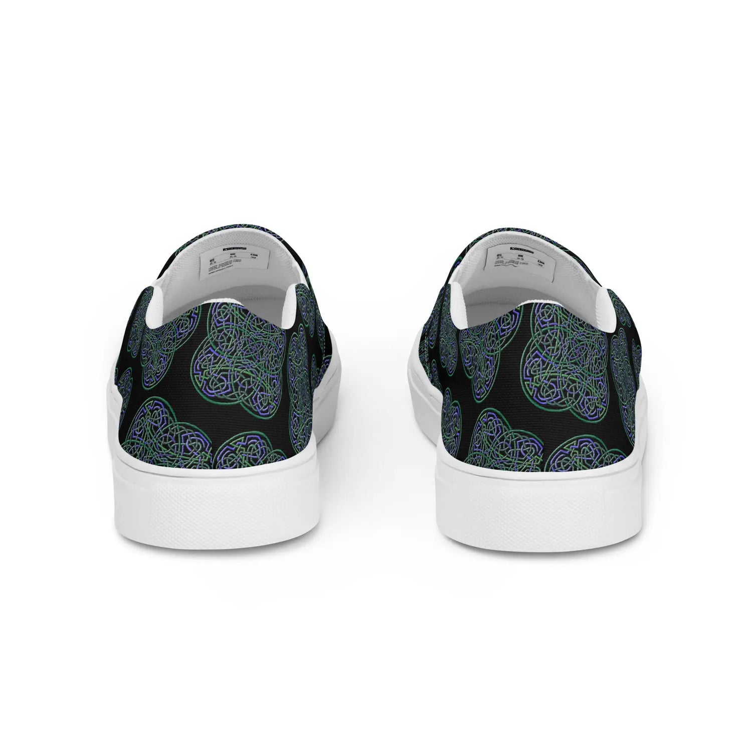 A view of the back of a pair of Xigfireon canvas slip-on shoes featuring the Living Colour on Black iteration of the Reach Of The Spirit Celtic knot pattern. The Reach Of The Spirit Celtic knot represents the Earth.