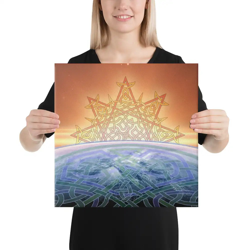 A young woman holding a 16 inch x 16 inch canvas print of the Derivation II Celtic knot design, which symbolizes the Sun and the Earth and their cosmic dance.